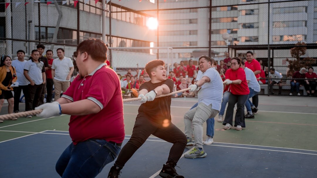 Colleagues playing a friendly sports tournament outdoors