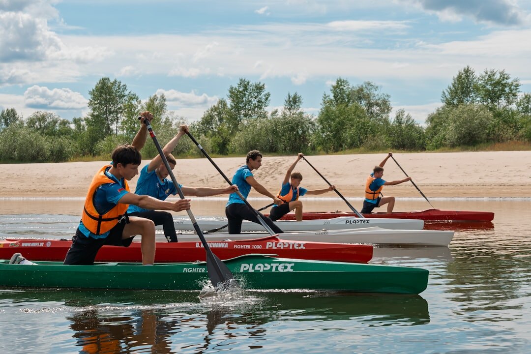 team kayaking together