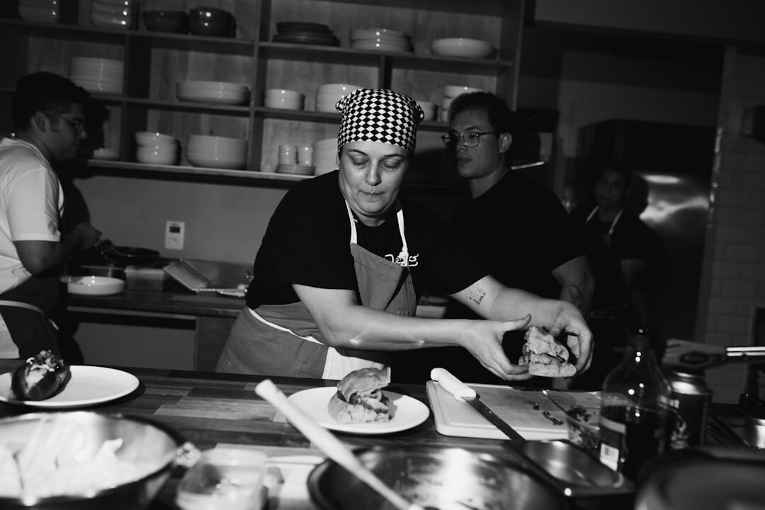Colleagues cooking together during a culinary team building workshop